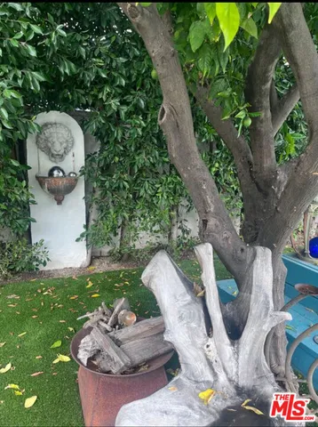 a backyard of a house with outdoor seating