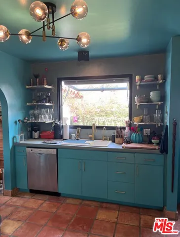 a room with cabinets and a large window