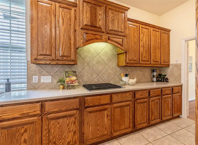 a sink with wooden cabinets