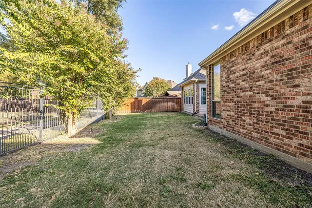 a view of backyard with green space