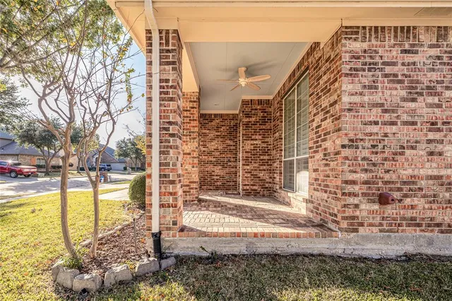 a view of a building with a backyard