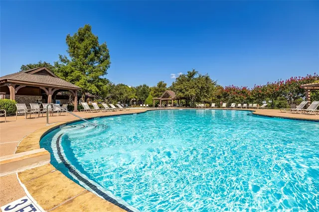 a view of a swimming pool with a patio