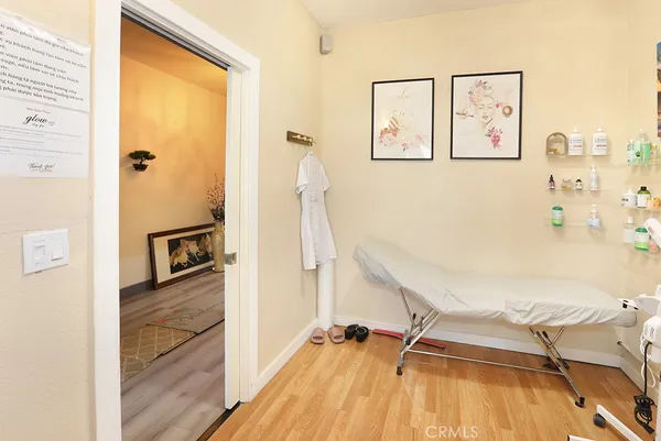 a view of a living room with a wooden floor