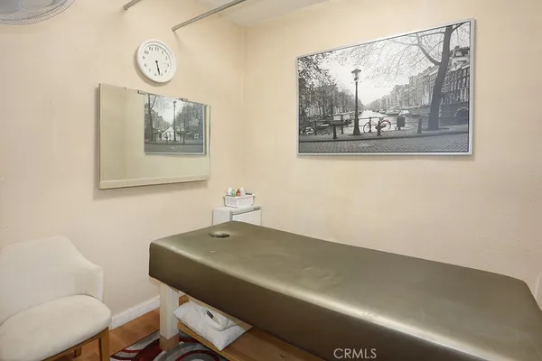 a view of a room with furniture and a window