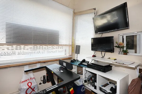 a view of a workspace with furniture