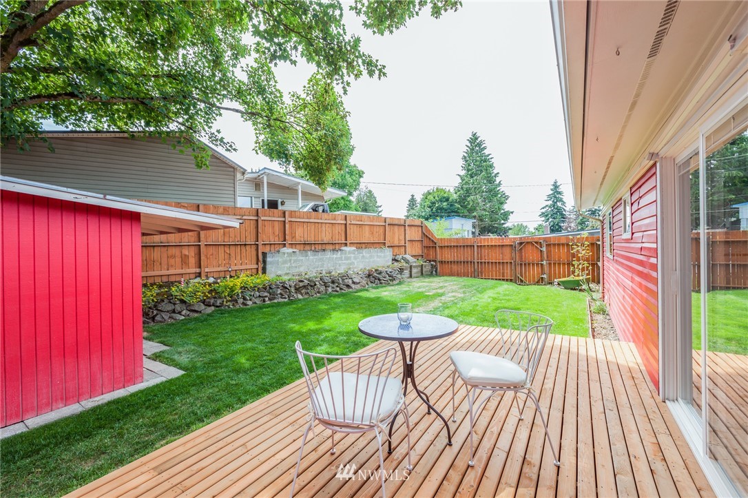634 Ferndale Place Northeast Renton, WA 98056 - Photo 1 of 25 a view of a backyard with sitting area