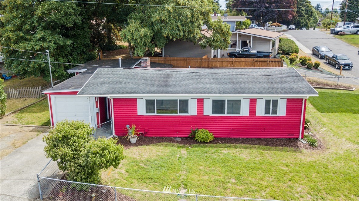 634 Ferndale Place Northeast Renton, WA 98056 - Photo 2 of 25 a front view of a house with garden