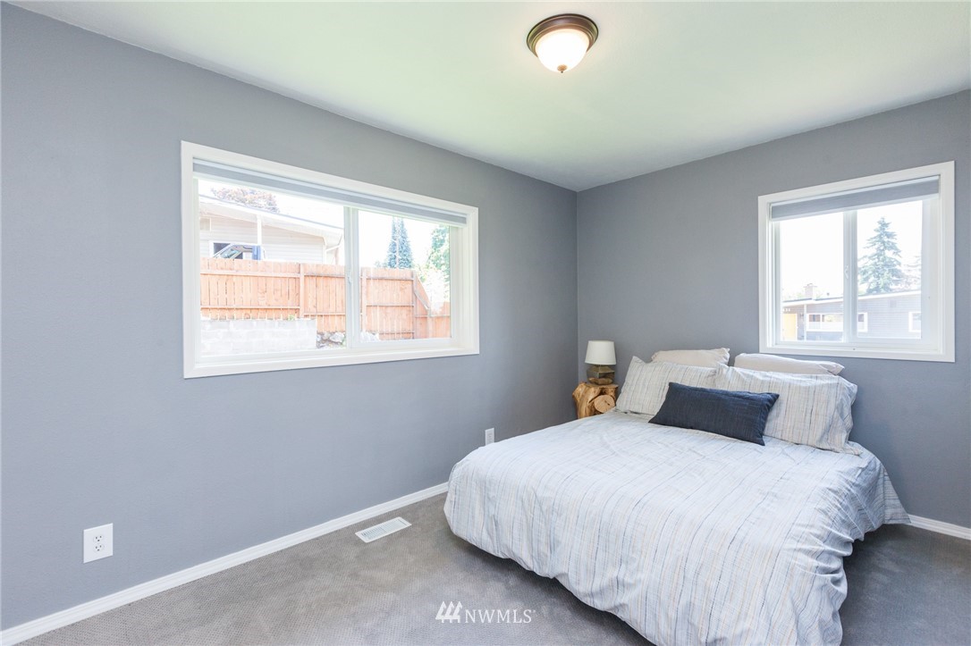 634 Ferndale Place Northeast Renton, WA 98056 - Photo 11 of 25 a bedroom with a bed and window