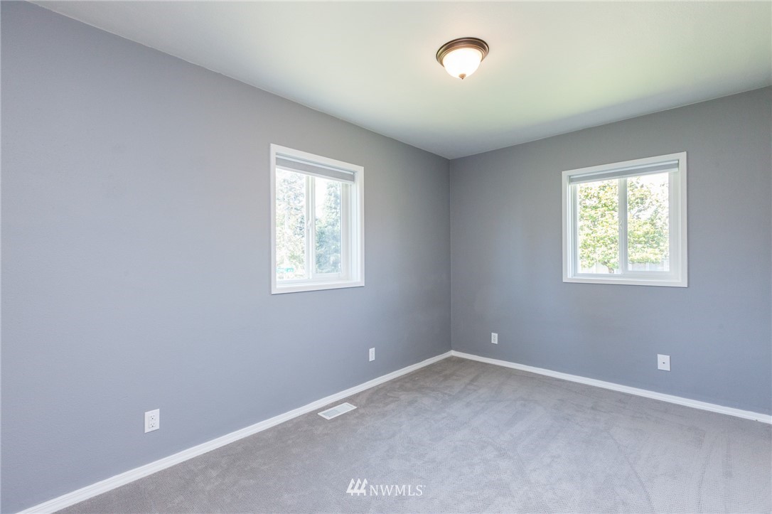 634 Ferndale Place Northeast Renton, WA 98056 - Photo 13 of 25 an empty room with windows