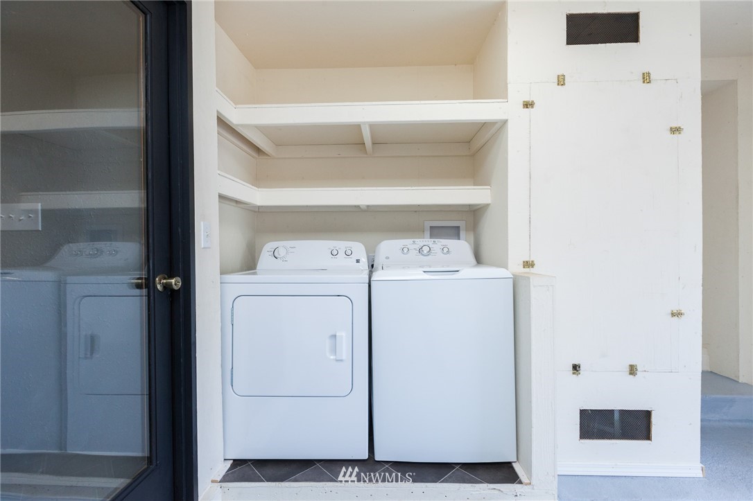 634 Ferndale Place Northeast Renton, WA 98056 - Photo 19 of 25 a utility room with dryer and washer