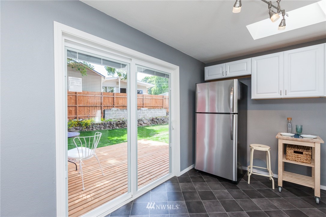 634 Ferndale Place Northeast Renton, WA 98056 - Photo 9 of 25 a view of kitchen with furniture refrigerator and window