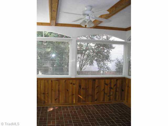 700 Sunset Drive High Point, NC 27262 - Photo 3 of 9 Other. Sunroom features ceiling fan and terra cotta floors