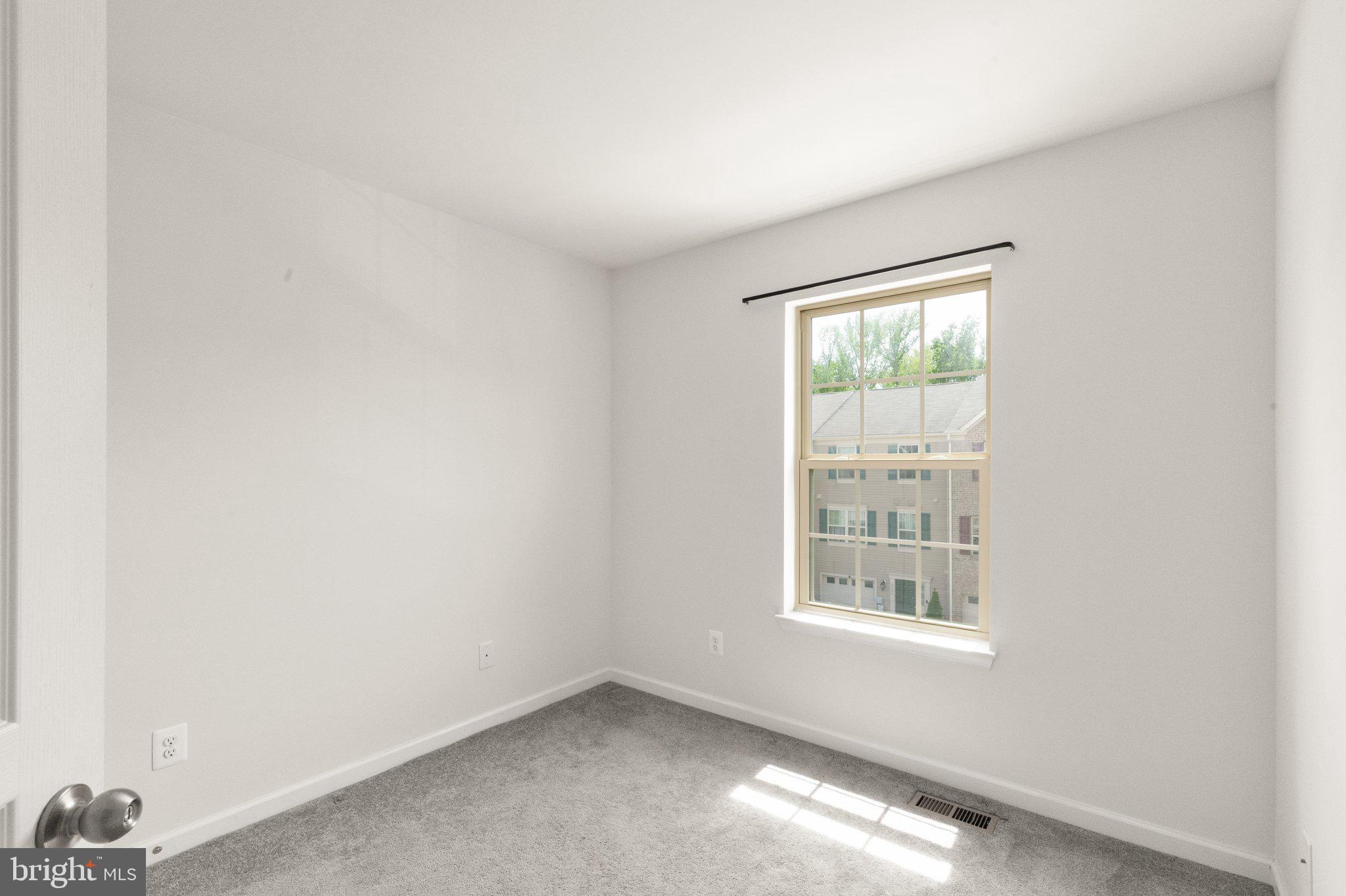 9943 Ravenhurst Road Middle River, MD 21220 - Photo 16 of 23 an empty room with windows