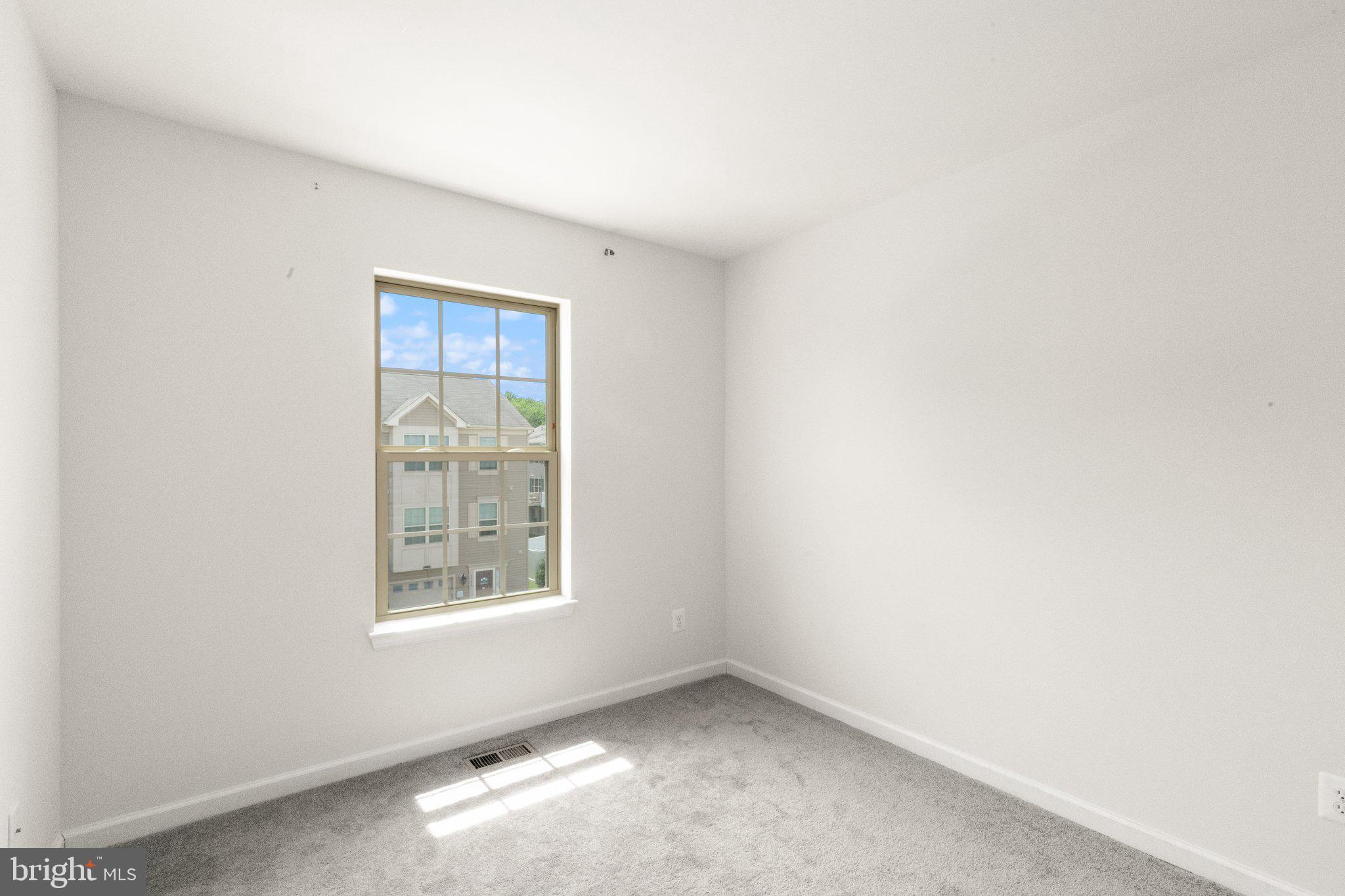 9943 Ravenhurst Road Middle River, MD 21220 - Photo 19 of 23 an empty room with windows