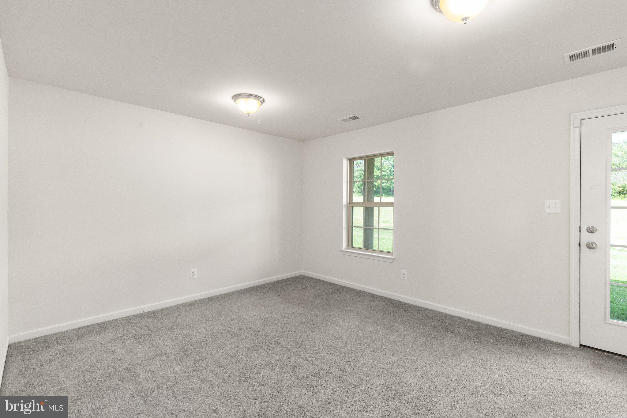9943 Ravenhurst Road Middle River, MD 21220 - Photo 21 of 23 an empty room with a window