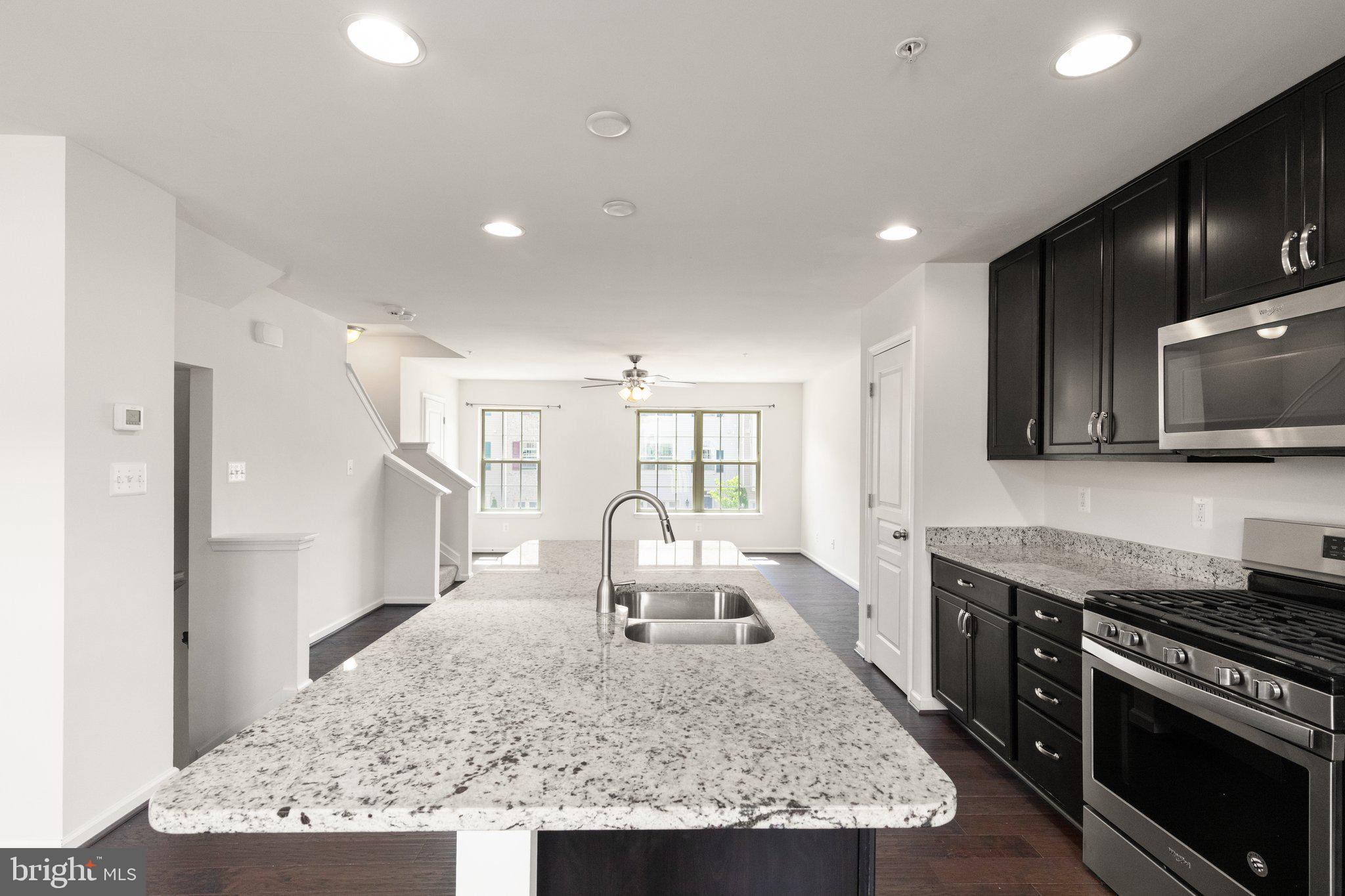 9943 Ravenhurst Road Middle River, MD 21220 - Photo 4 of 23 a living room with stainless steel appliances granite countertop furniture and a view of kitchen