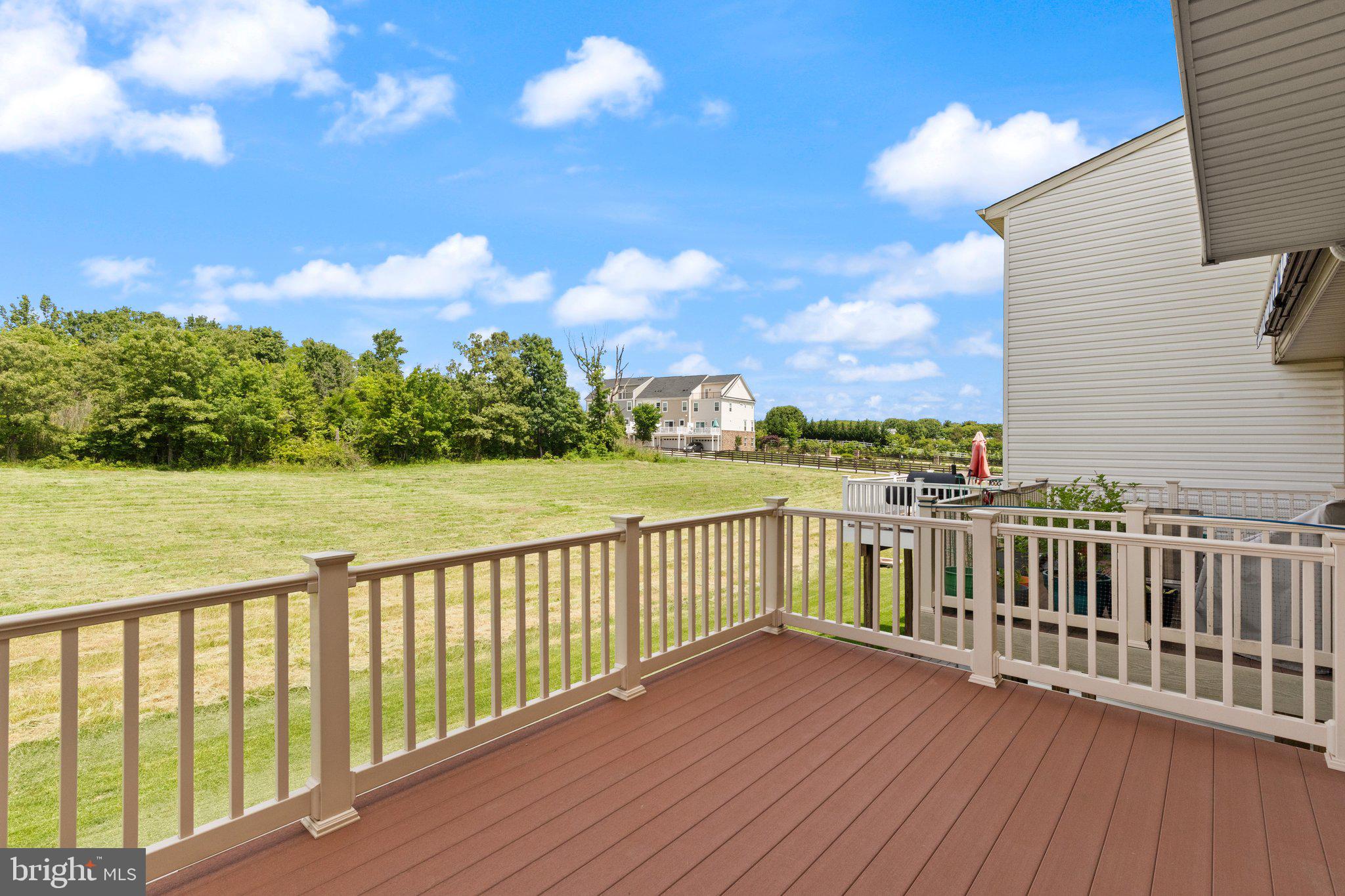 9943 Ravenhurst Road Middle River, MD 21220 - Photo 10 of 23 a view of a balcony with wooden floor & fence