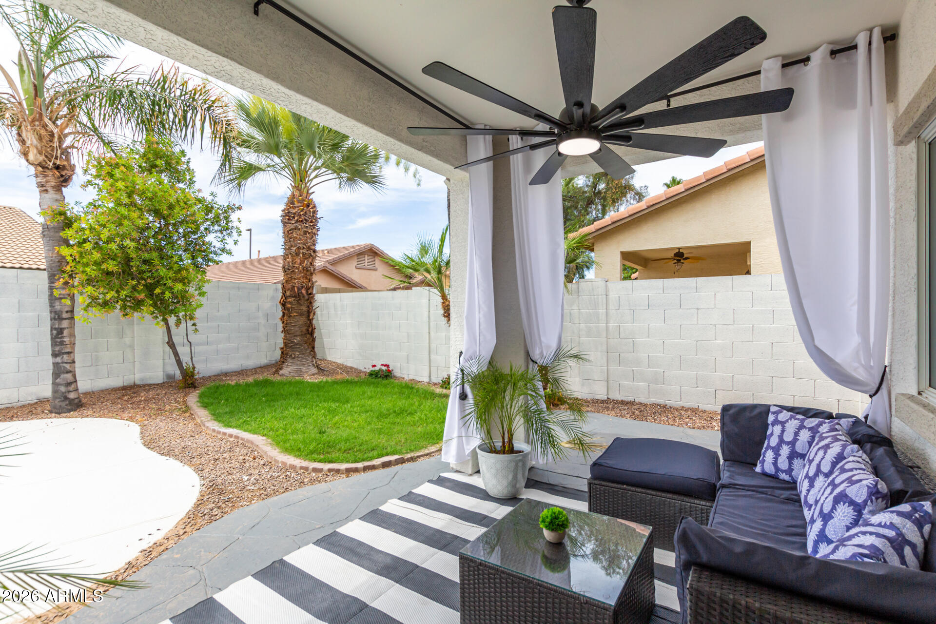3674 South Joshua Tree Lane Gilbert, AZ 85297 - Photo 26 of 30 a outdoor living space with furniture