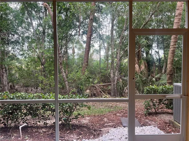 a view of a yard from a balcony
