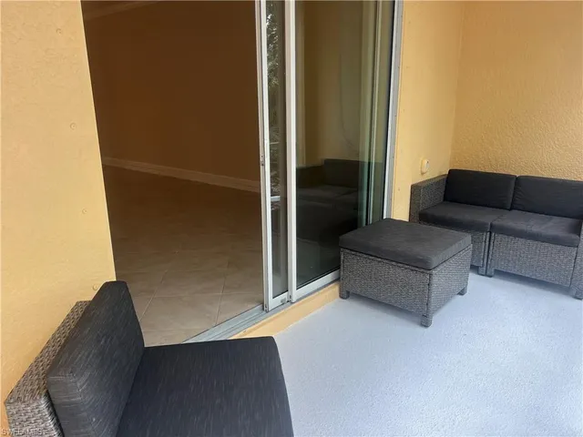 a living room with furniture and a gate