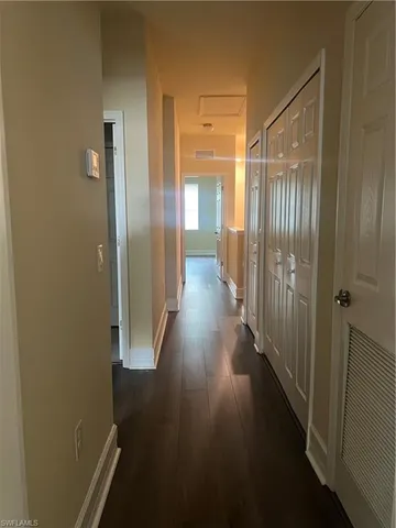 a view of gallery with wooden floor