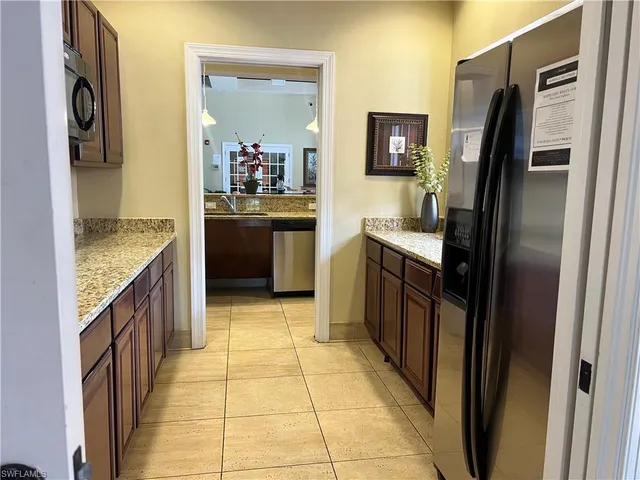 a view of a backyard with palm trees