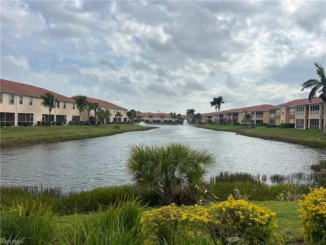 a view of a house with a garden and swimming pool