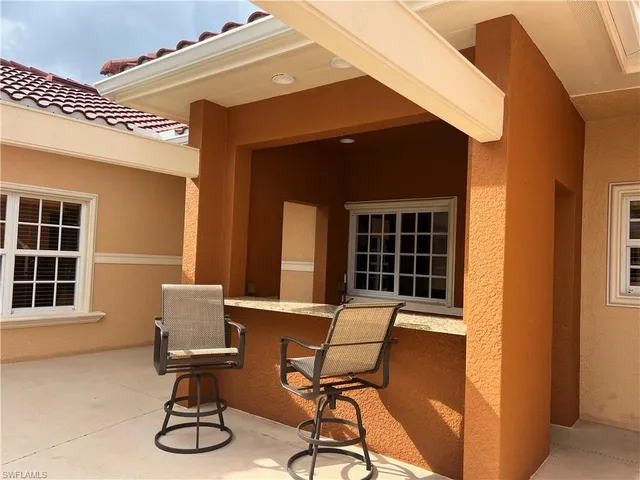 a view of a swimming pool and lounge chairs
