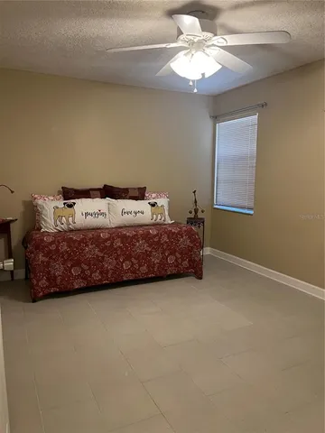 a room with a bed and a chandelier