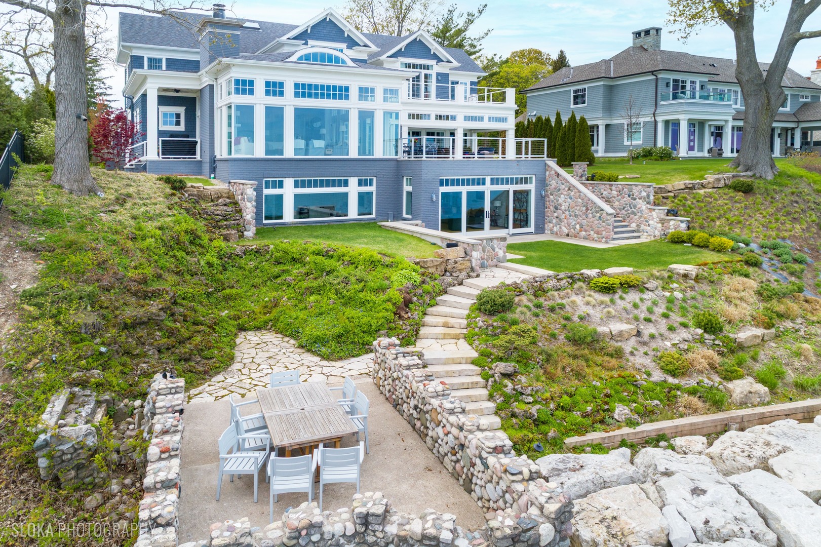139 Sheridan Road Winnetka, IL 60093 - Photo 40 of 51 a front view of a residential apartment building with a yard