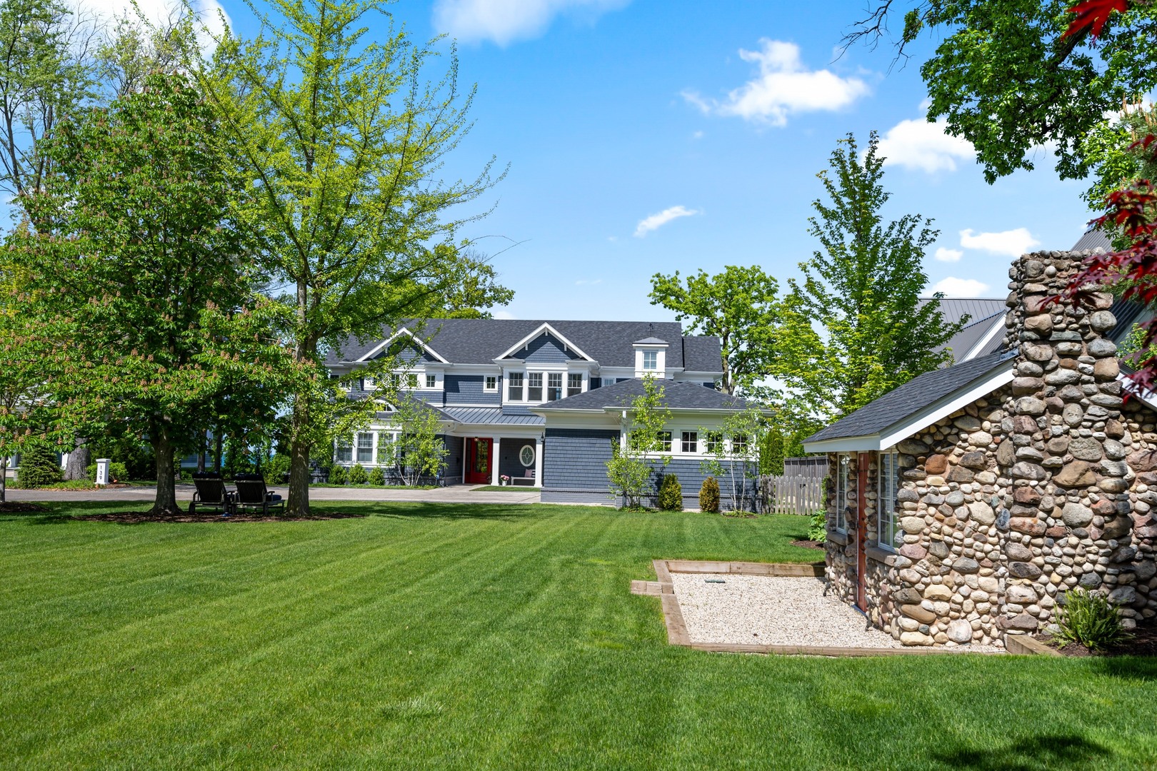 139 Sheridan Road Winnetka, IL 60093 - Photo 47 of 51 a front view of a house with a yard