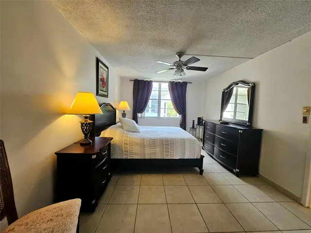 a bed room with a bed and a lamp