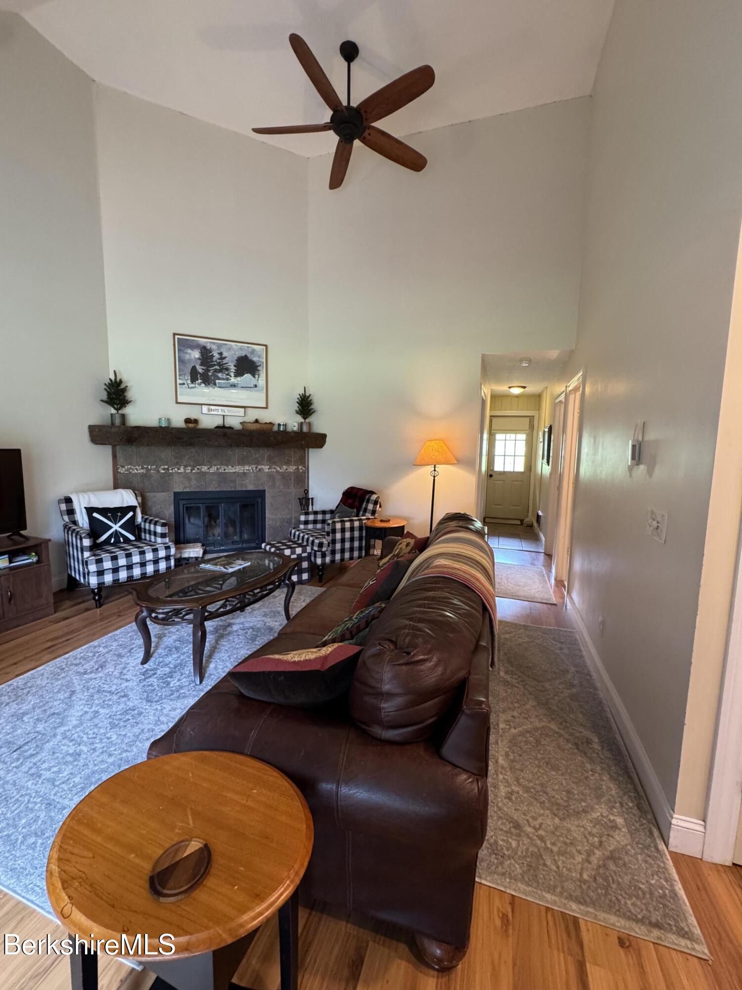 37 Corey Road, Unit 73 Hancock, MA 01237 - Photo 19 of 24 a living room with furniture and a fireplace