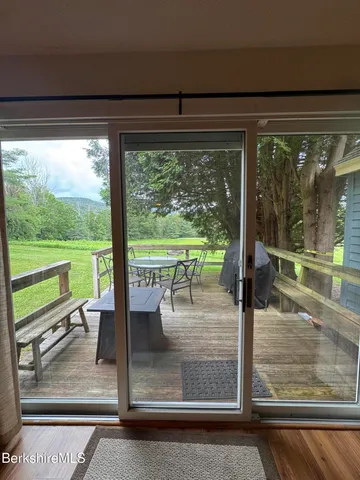 a dining room with glass door