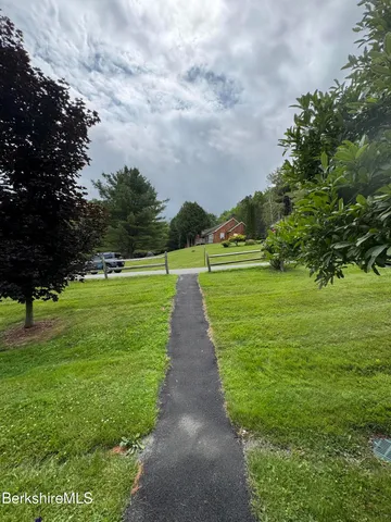a view of a golf course with a garden