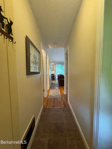a view of a hallway with a furniture