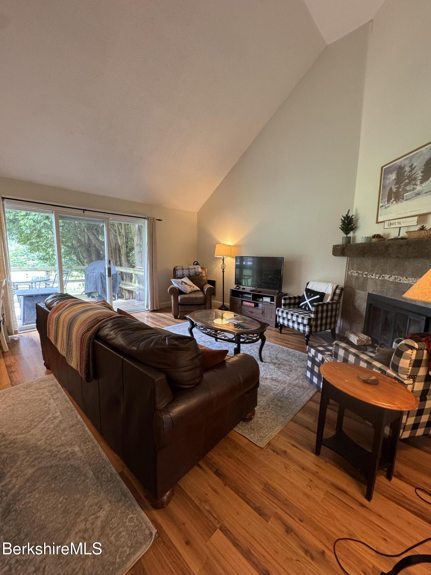 37 Corey Road, Unit 73 Hancock, MA 01237 - Photo 7 of 24 a living room with furniture and a fireplace