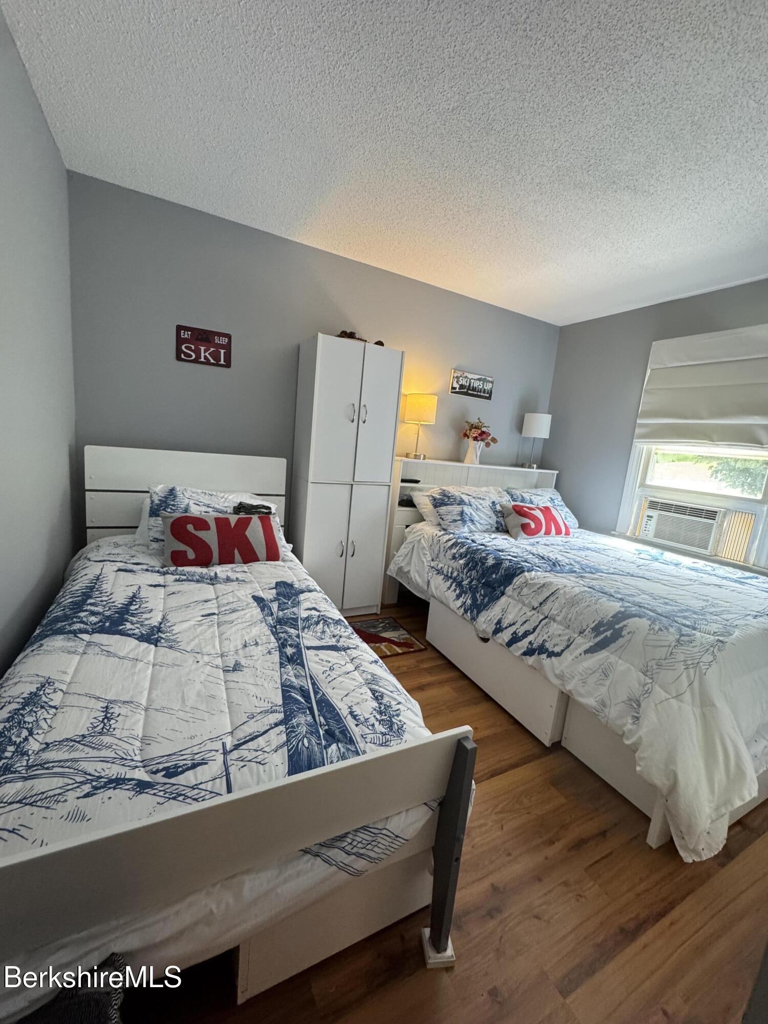 37 Corey Road, Unit 73 Hancock, MA 01237 - Photo 8 of 24 a bedroom with a bed and a dresser