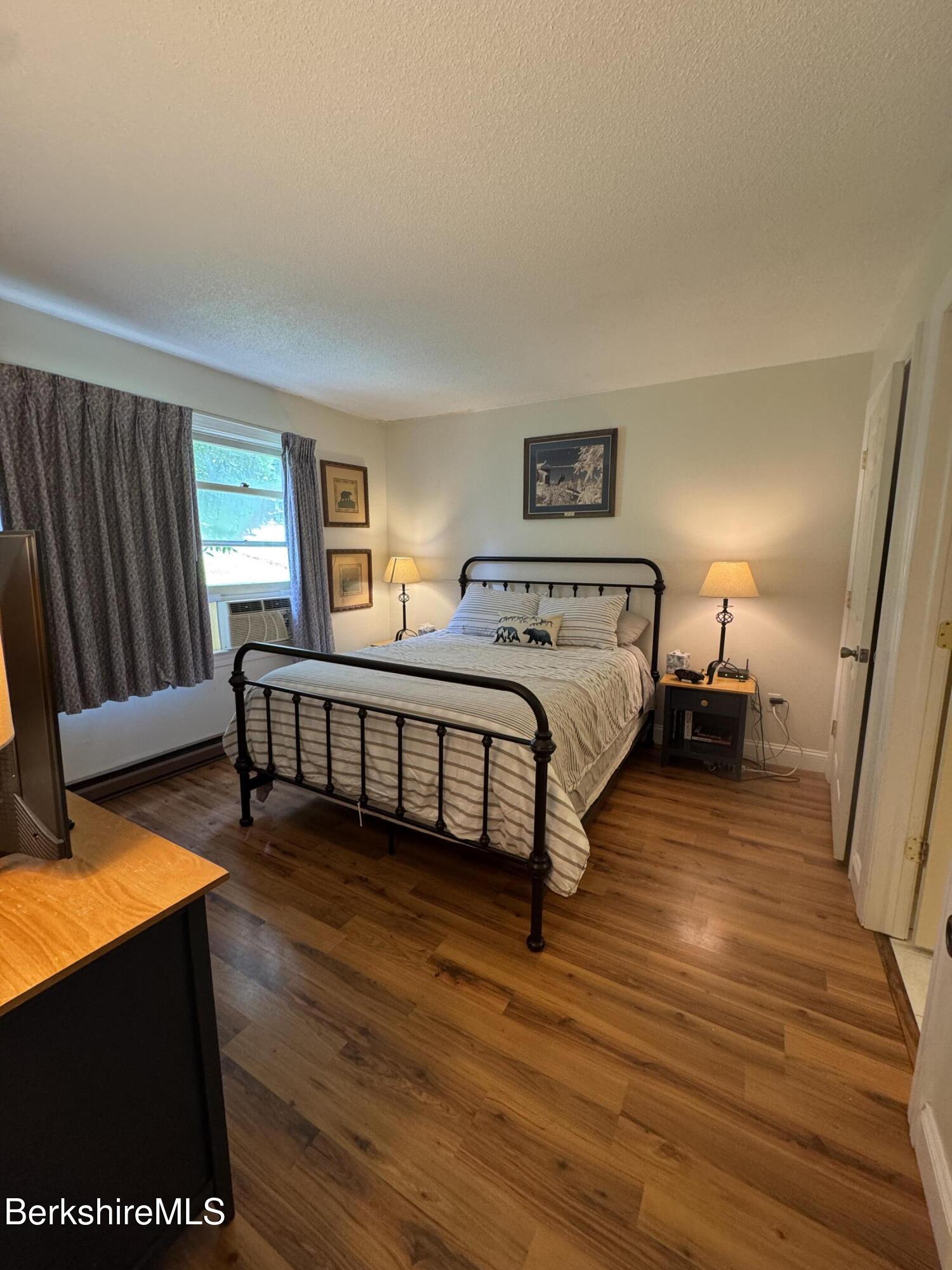 37 Corey Road, Unit 73 Hancock, MA 01237 - Photo 9 of 24 a spacious bedroom with two beds and a desk