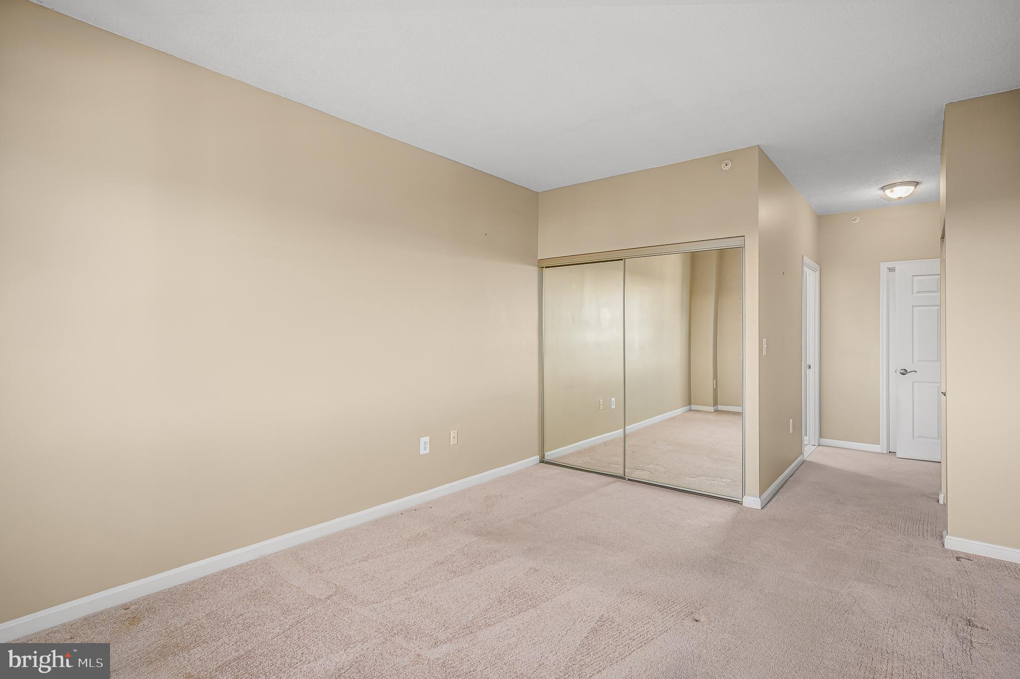 19365 Cypress Ridge Terrace, Unit 1115 Leesburg, VA 20176 - Photo 15 of 34 2 closets in bedroom, one slider and a walk-in