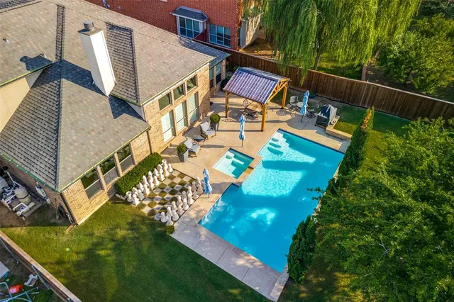 an aerial view of house with yard