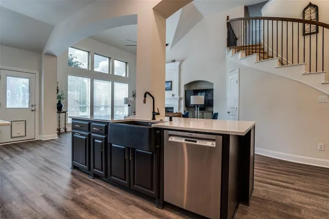 a kitchen with stainless steel appliances granite countertop a stove and a sink
