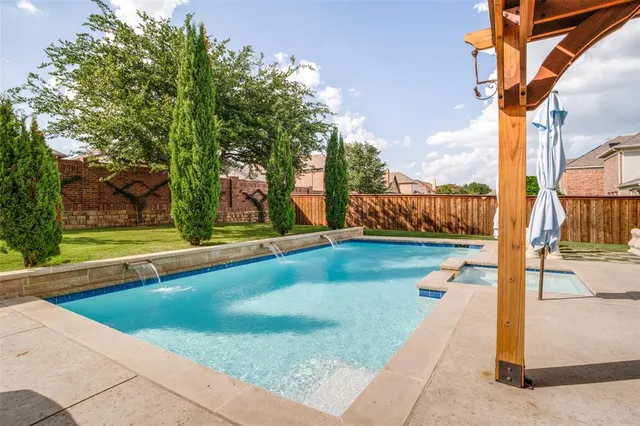 a view of swimming pool with a patio