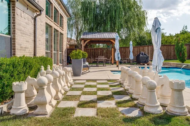 a view of an outdoor space with lounge chair