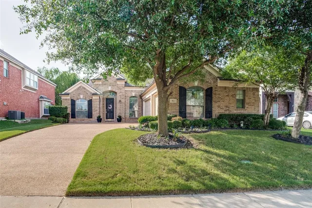 a front view of a house with yard porch and green space