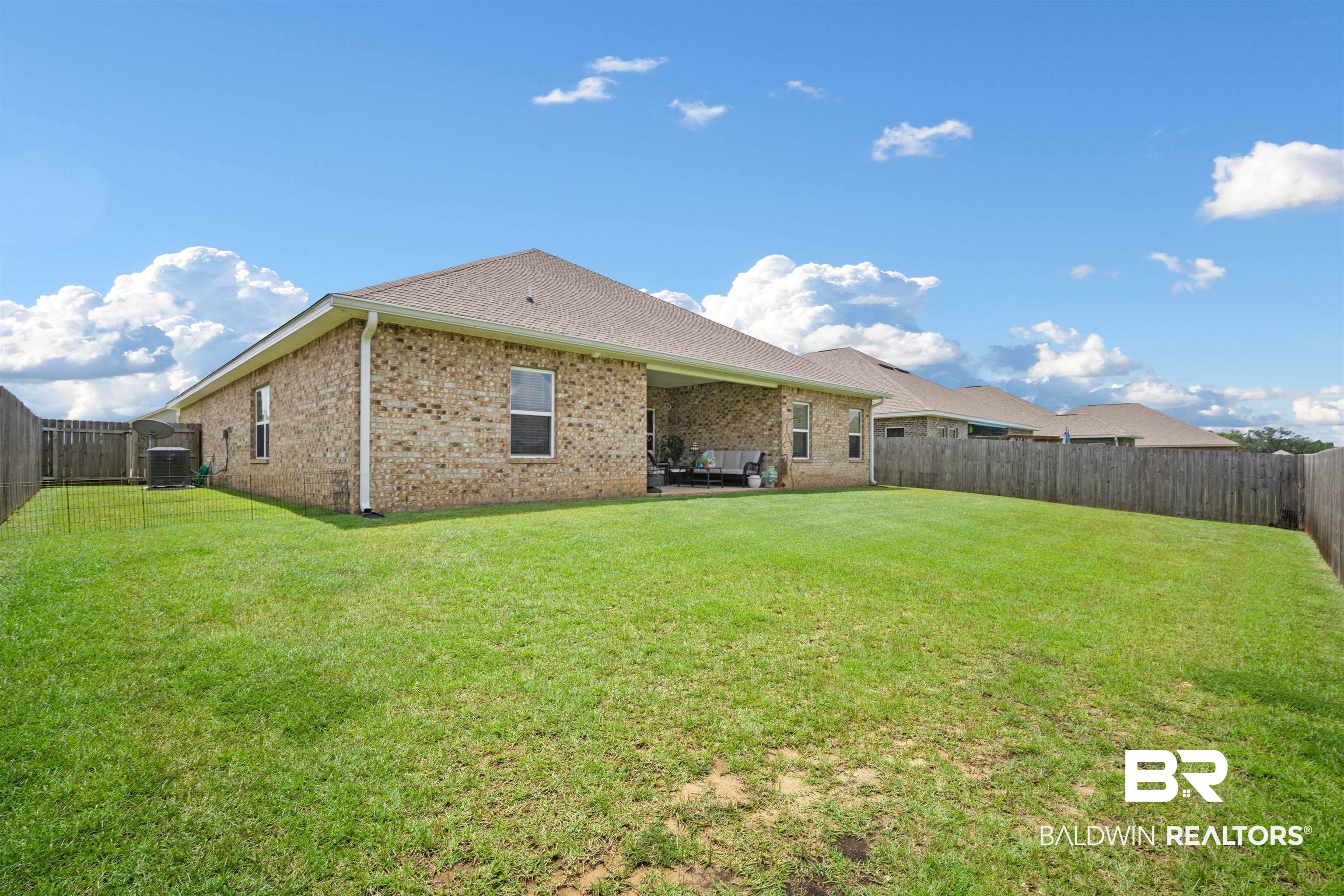 10474 Loamy Avenue Mobile, AL 36695 - Photo 28 of 31 Back of property featuring a fenced backyard and brick siding