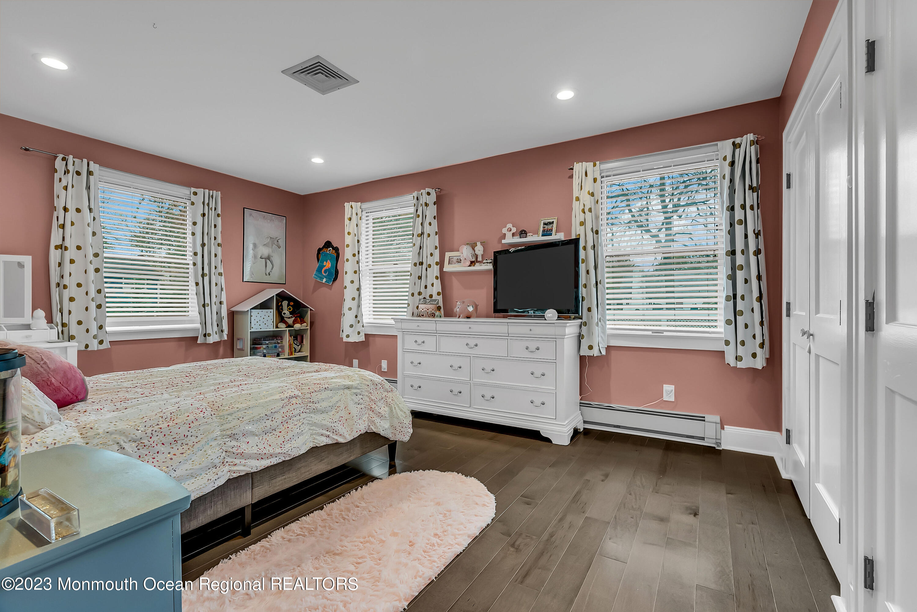 515 Monmouth Road West Allenhurst, NJ 07711 - Photo 11 of 45 a bedroom with furniture and flat screen tv