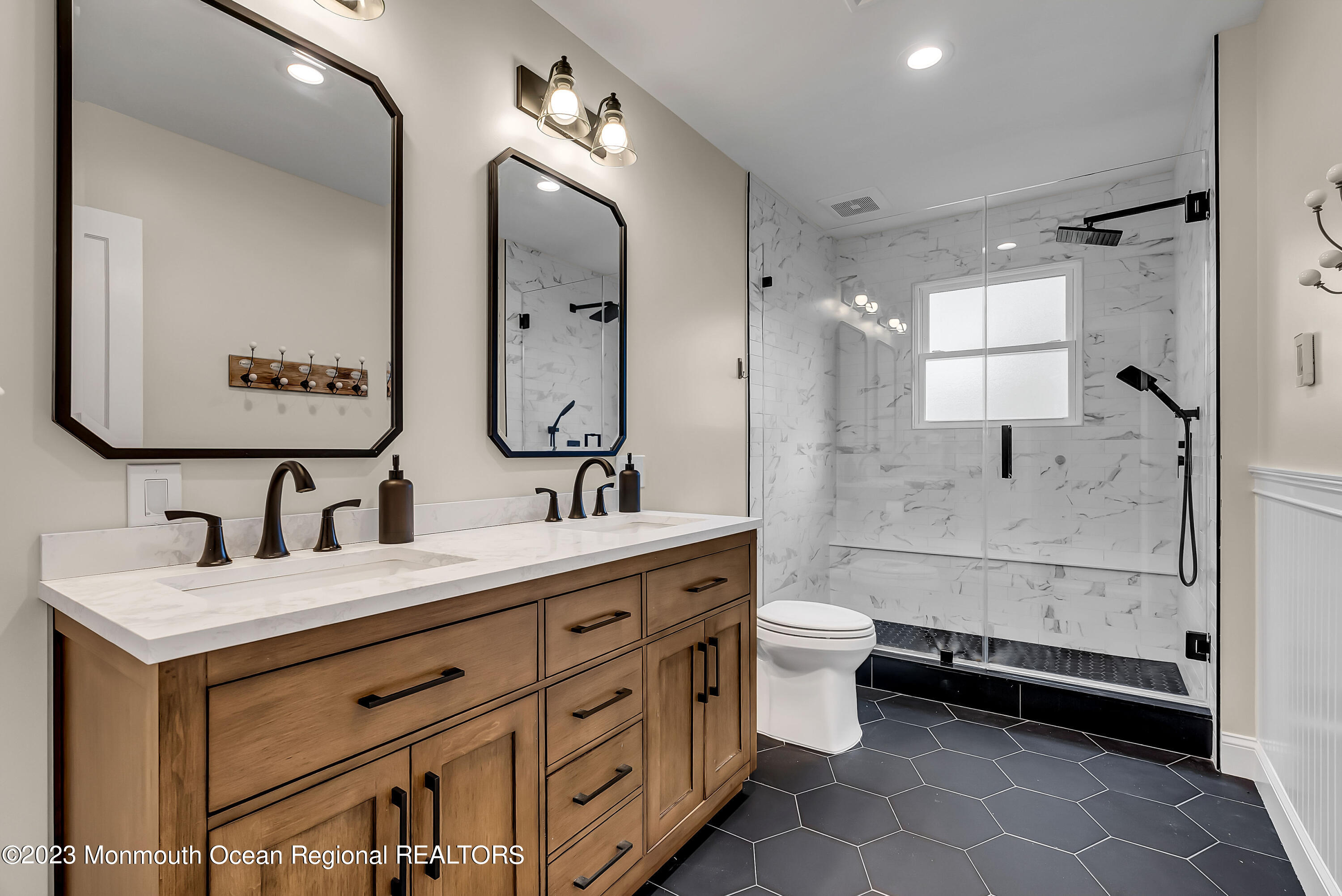 515 Monmouth Road West Allenhurst, NJ 07711 - Photo 12 of 45 a bathroom with a double vanity sink toilet mirror and bathtub