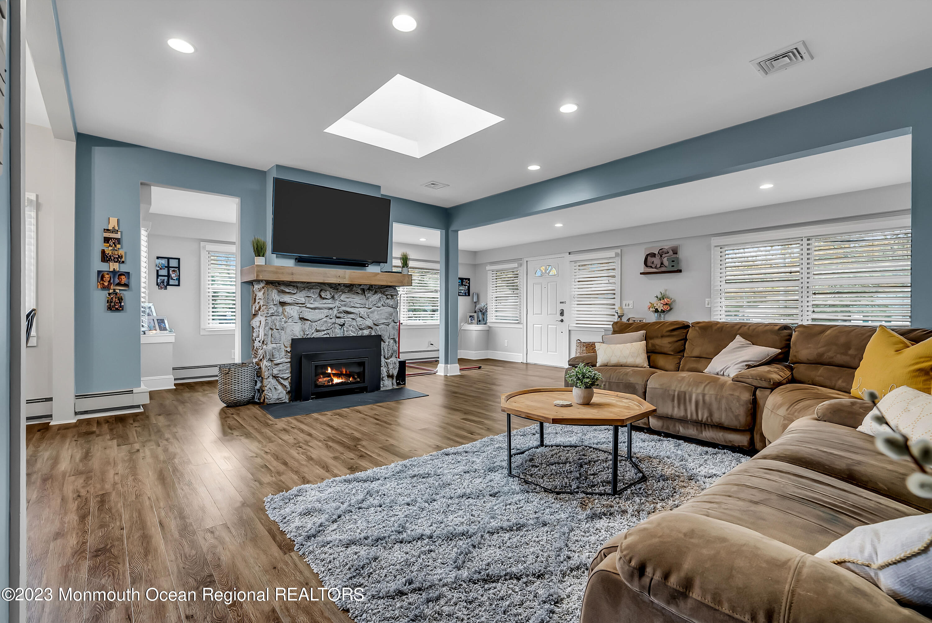 515 Monmouth Road West Allenhurst, NJ 07711 - Photo 2 of 45 a living room with furniture and a fireplace