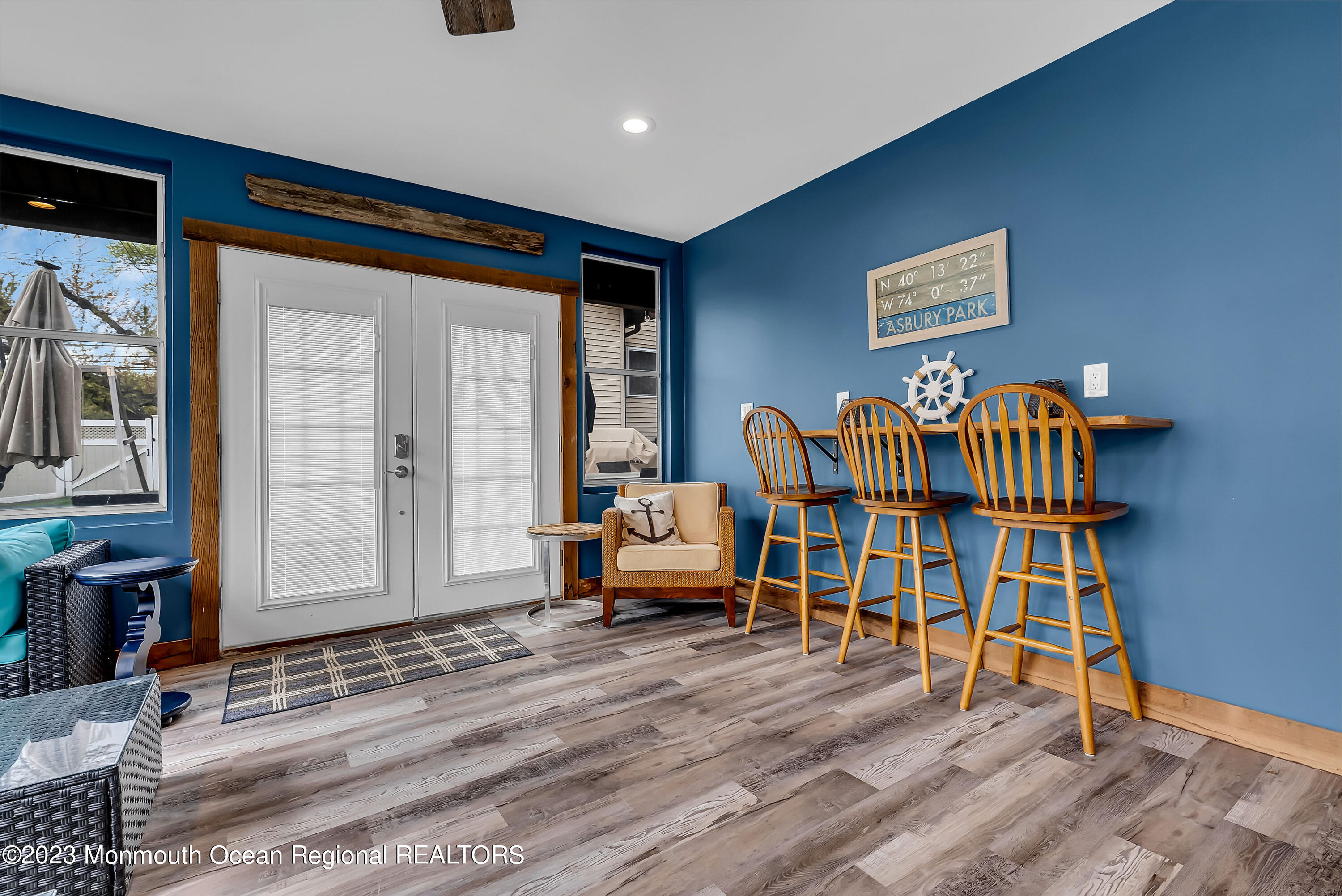 515 Monmouth Road West Allenhurst, NJ 07711 - Photo 21 of 45 a living room with furniture and a wooden floor